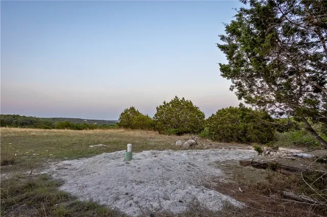 a view of a lake with houses in the background