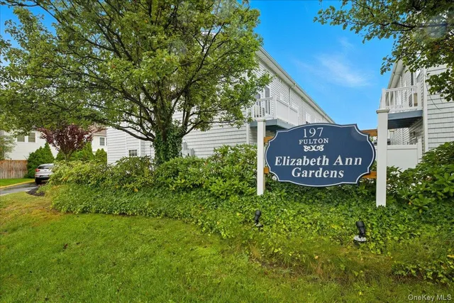 a sign on the side of the house