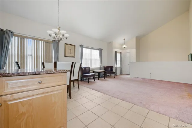 a view of living room with furniture and window