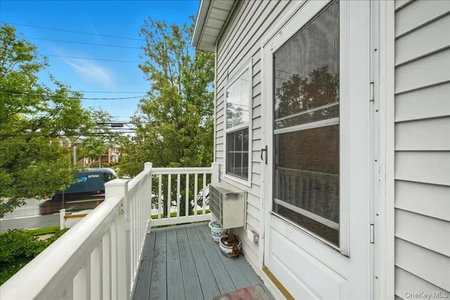 a balcony with wooden floor