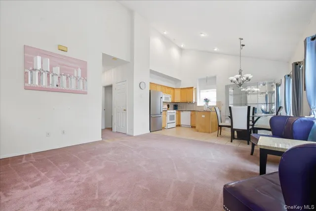 a view of a livingroom with furniture and a chandelier