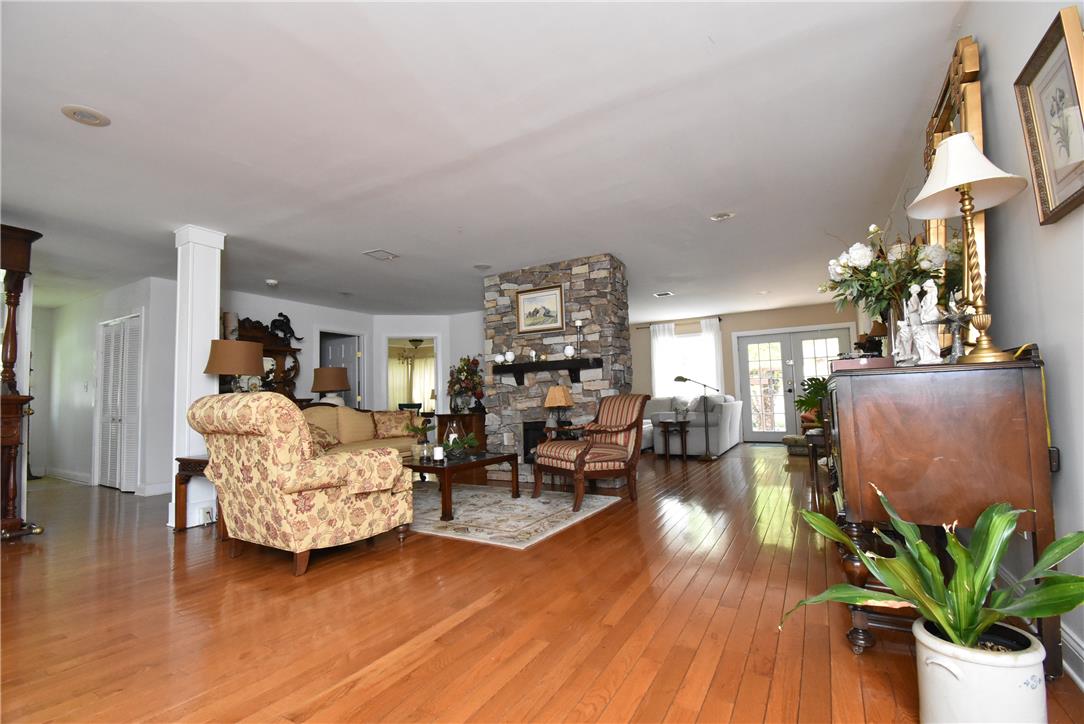 424 Grape Street Whitehall, PA 18052 - Photo 17 of 50 This expansive living area features lustrous hardwood flooring and a beautiful stone fireplace.