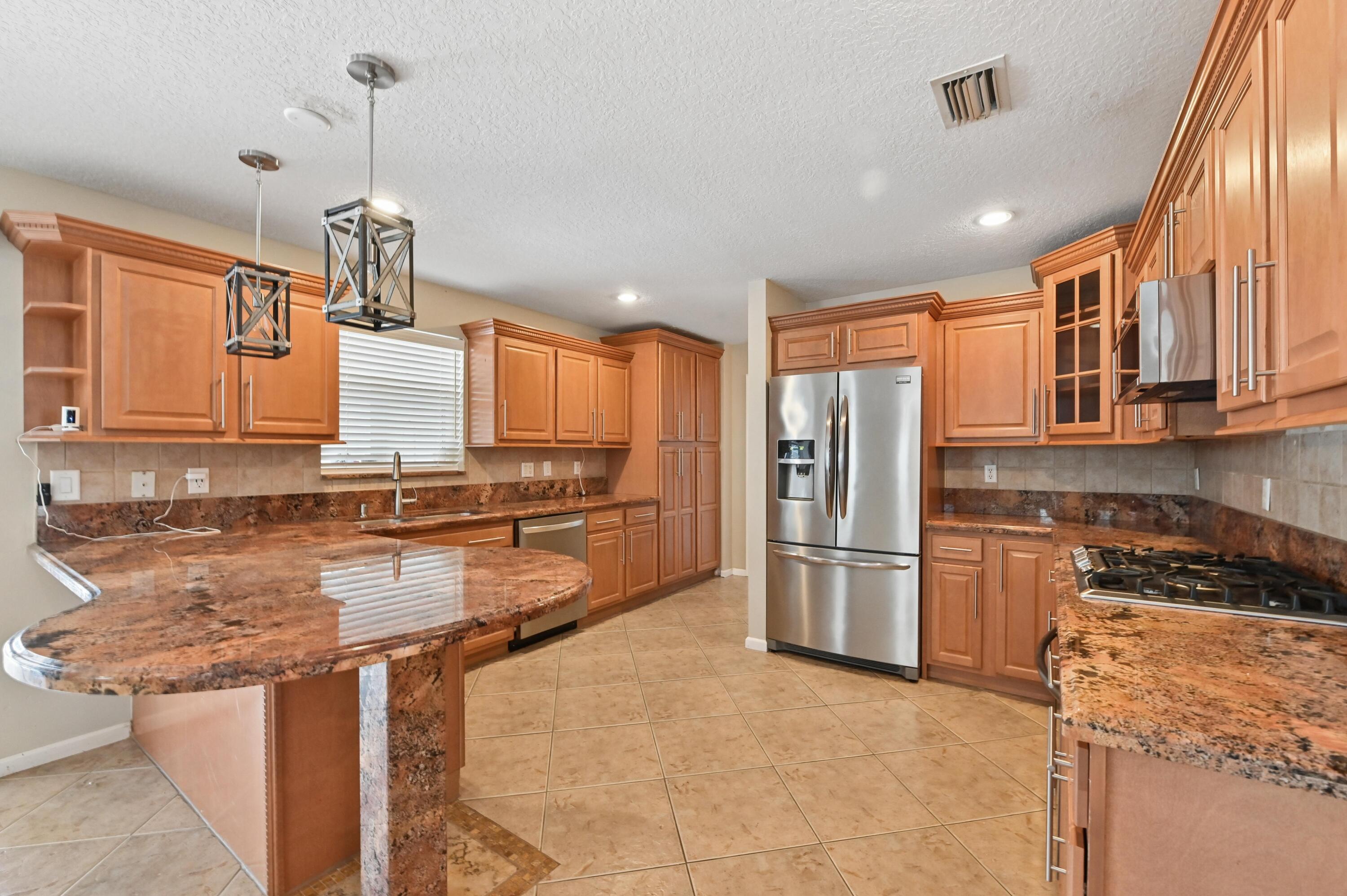 1163 Peninsula Way Greenacres, FL 33413 - Photo 11 of 40 14 Kitchen 02