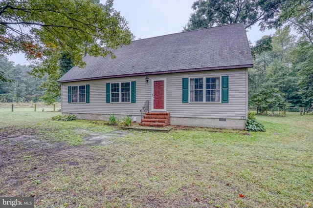 a backyard of a house with oven and garden