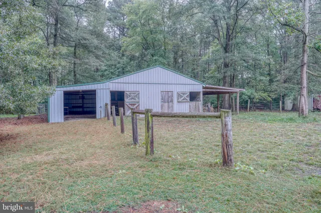 a house that has a tree in front of it