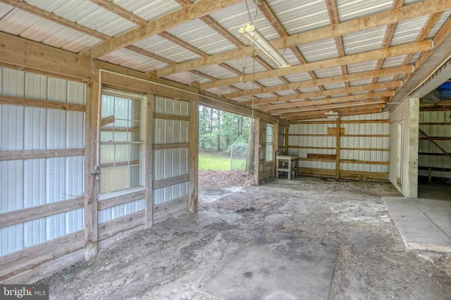 a view of a big room with wooden walls