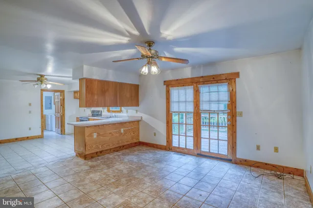 a view of room with window and chandelier fan