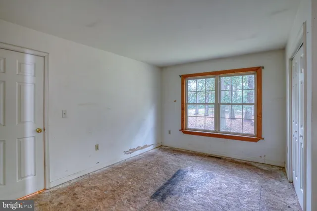 an empty room with windows