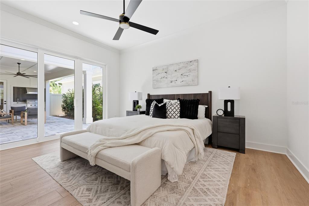 1063 Southwest 135th Way Newberry, FL 32669 - Photo 22 of 42 a bedroom with a bed and wooden floor