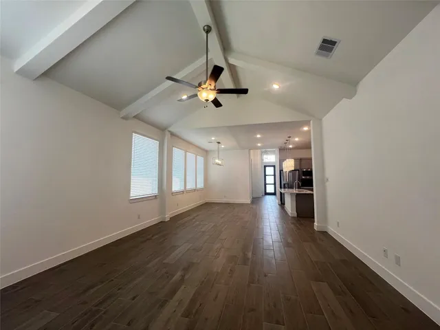 a view of a room window and wooden floor
