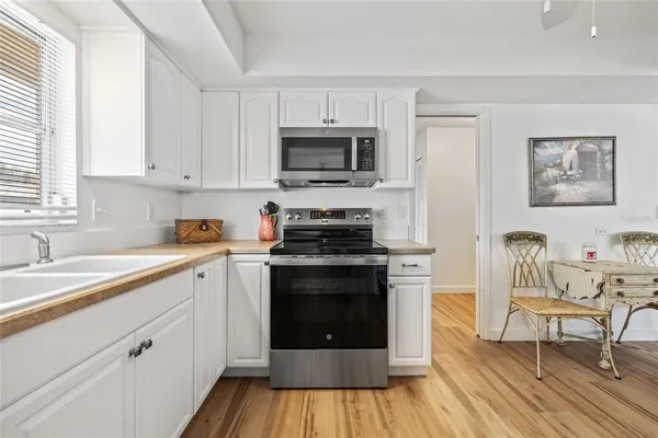 a kitchen with a stove and a sink