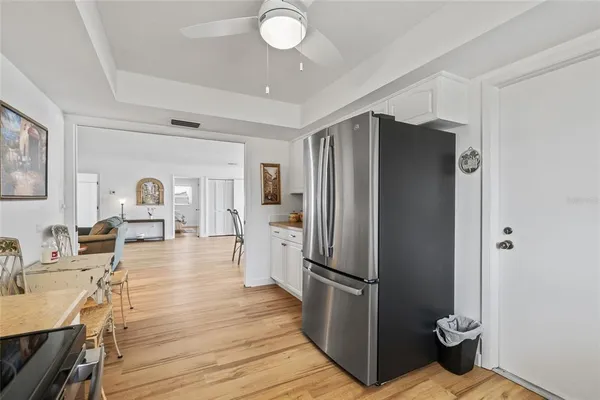 a kitchen with stainless steel appliances granite countertop a refrigerator and a stove