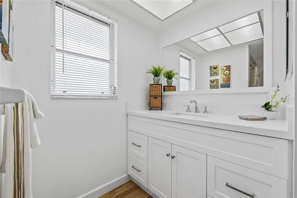 a bathroom with a sink and a mirror