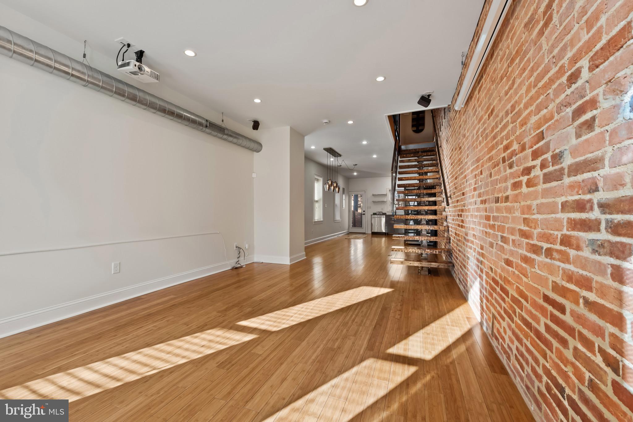 412 East Lanvale Street Baltimore, MD 21202 - Photo 11 of 28 Spacious loft with exposed brick charm.