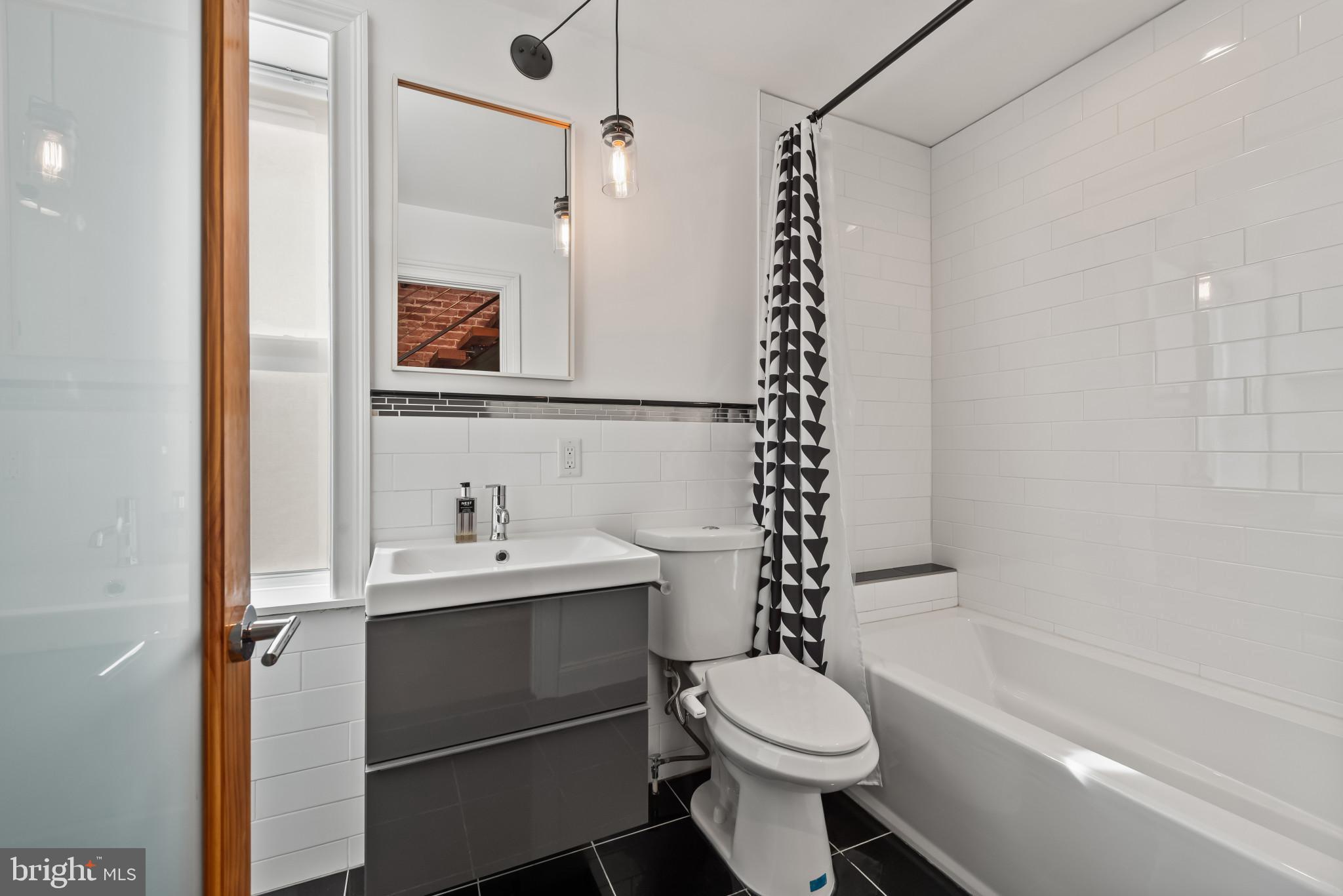 412 East Lanvale Street Baltimore, MD 21202 - Photo 20 of 28 Sleek modern bathroom with stylish accents.