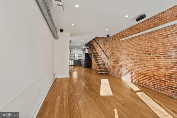 a view of entryway with wooden floor