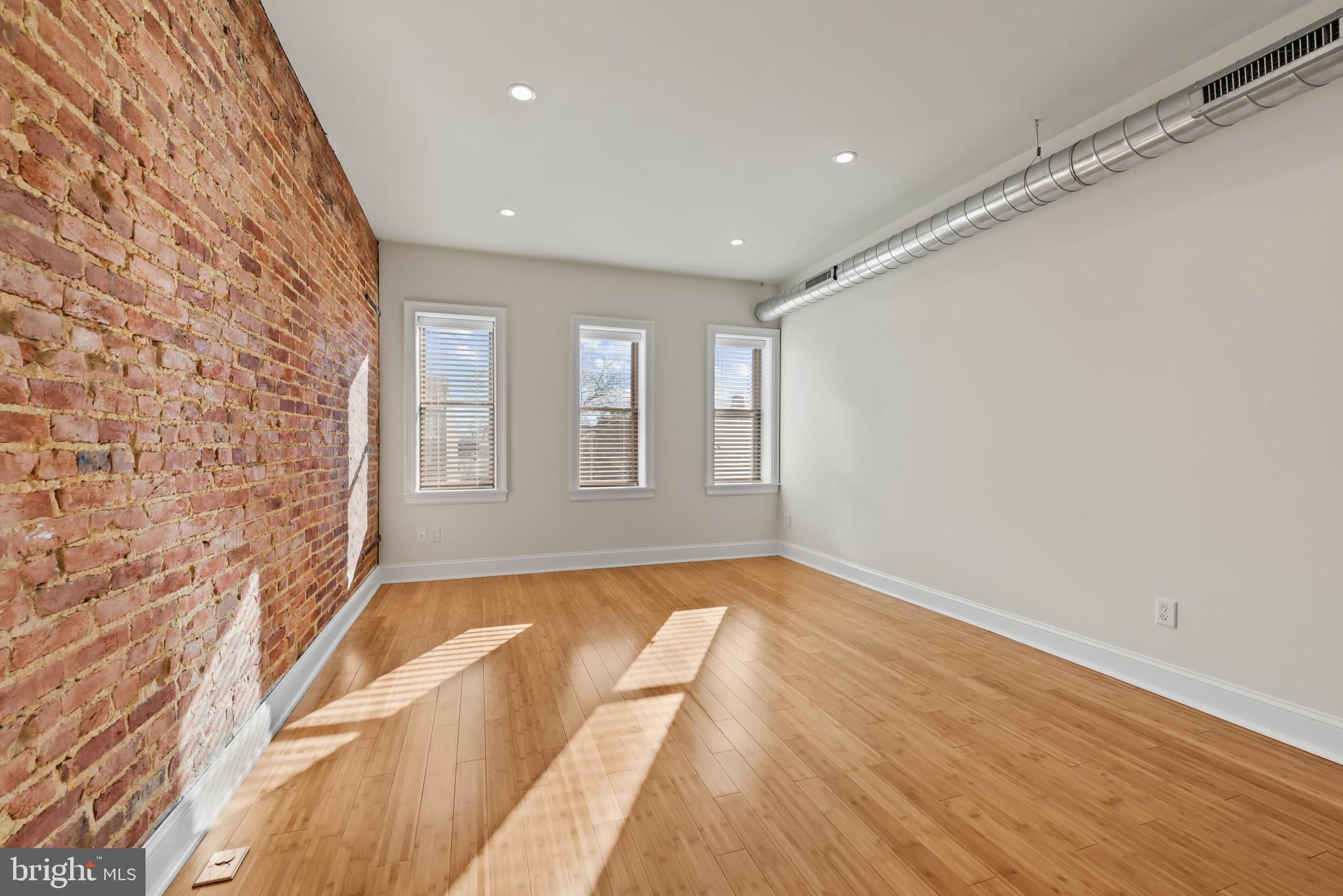 412 East Lanvale Street Baltimore, MD 21202 - Photo 21 of 28 Bright, airy space with exposed brick charm.