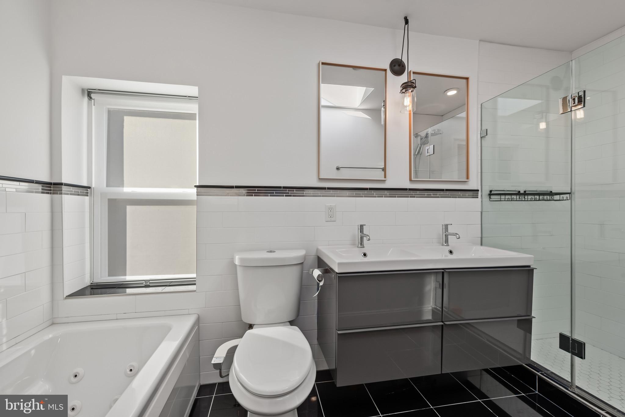 412 East Lanvale Street Baltimore, MD 21202 - Photo 25 of 28 Sleek modern bathroom with elegant finishes.
