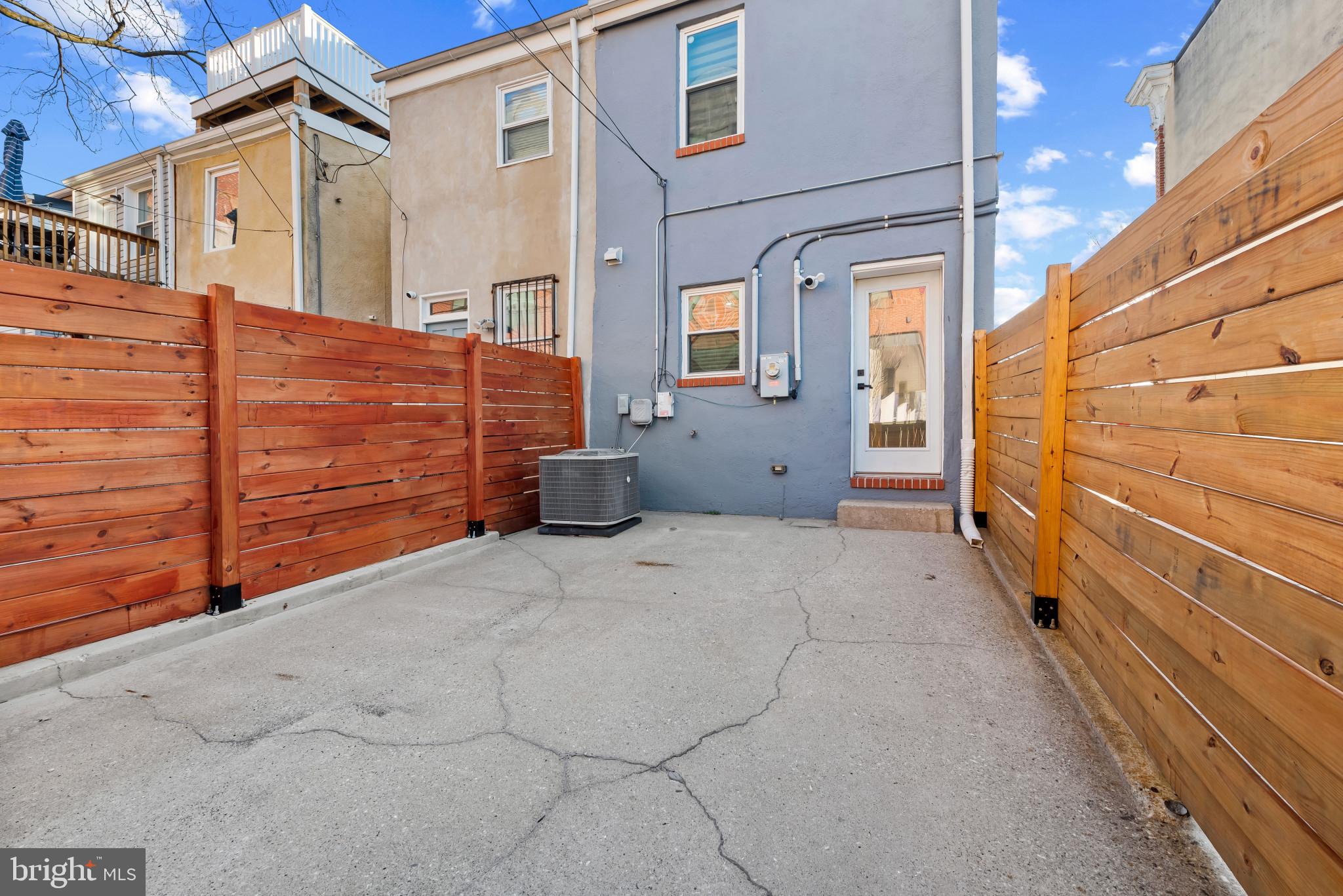 412 East Lanvale Street Baltimore, MD 21202 - Photo 28 of 28 Charming outdoor space with modern fencing.