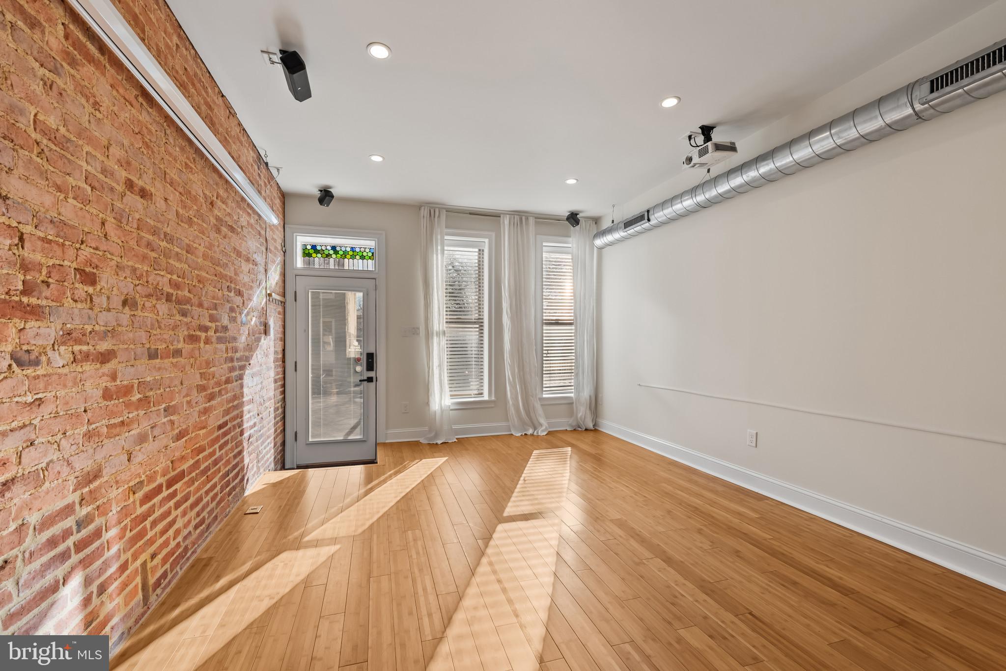 412 East Lanvale Street Baltimore, MD 21202 - Photo 4 of 28 Bright, airy space with exposed brick charm.