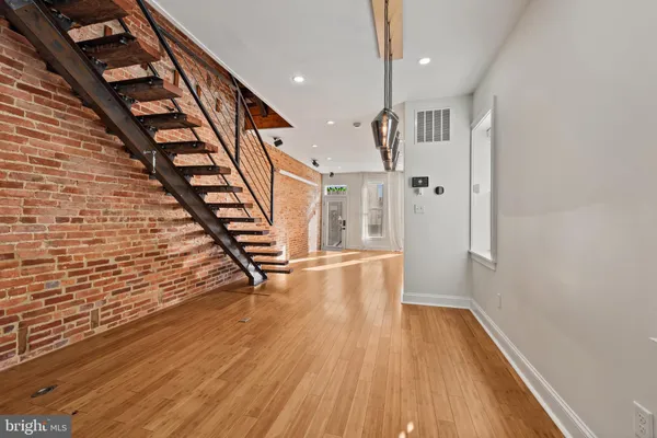 a view of entryway with wooden floor