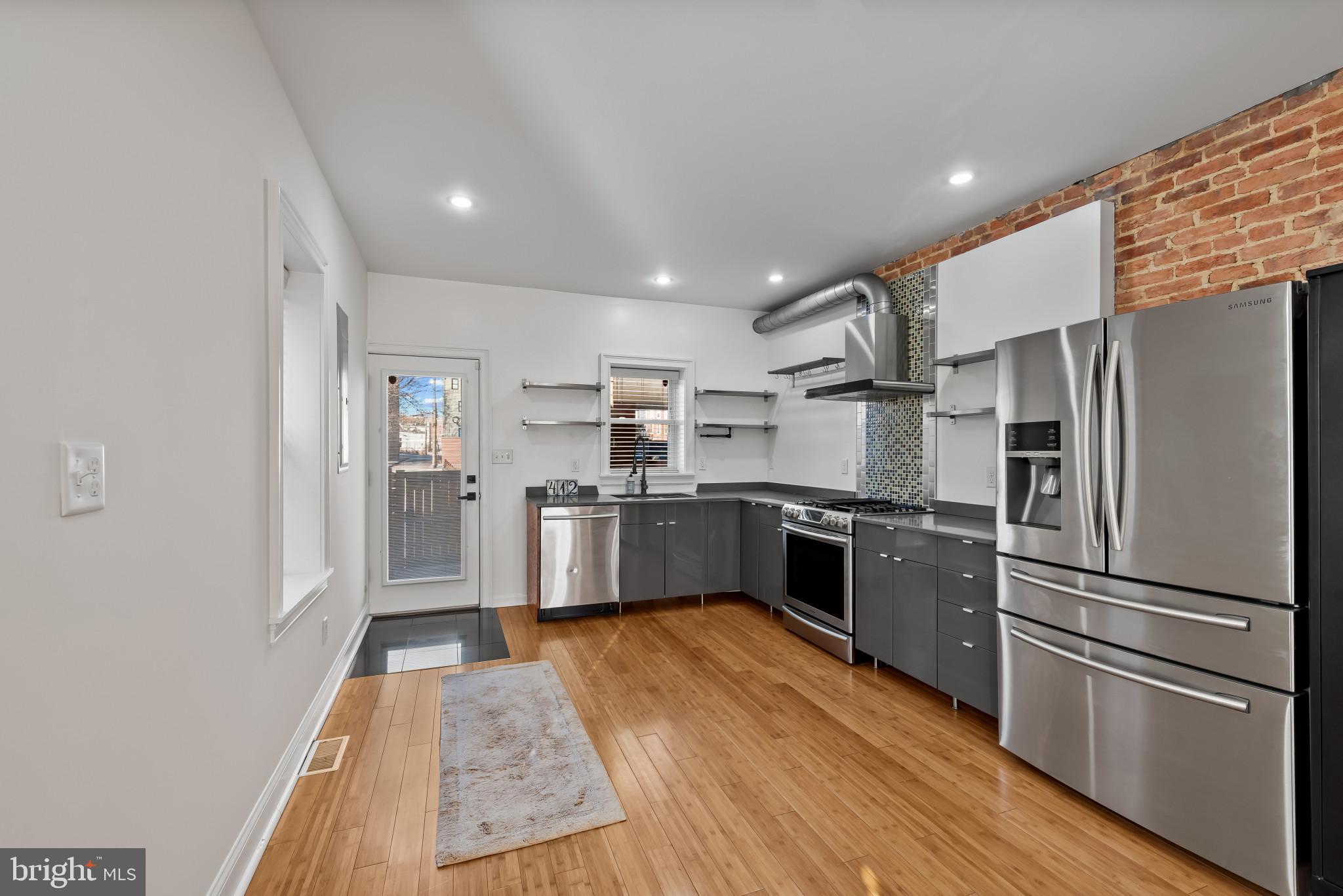 412 East Lanvale Street Baltimore, MD 21202 - Photo 9 of 28 Sleek kitchen with modern finishes and charm.