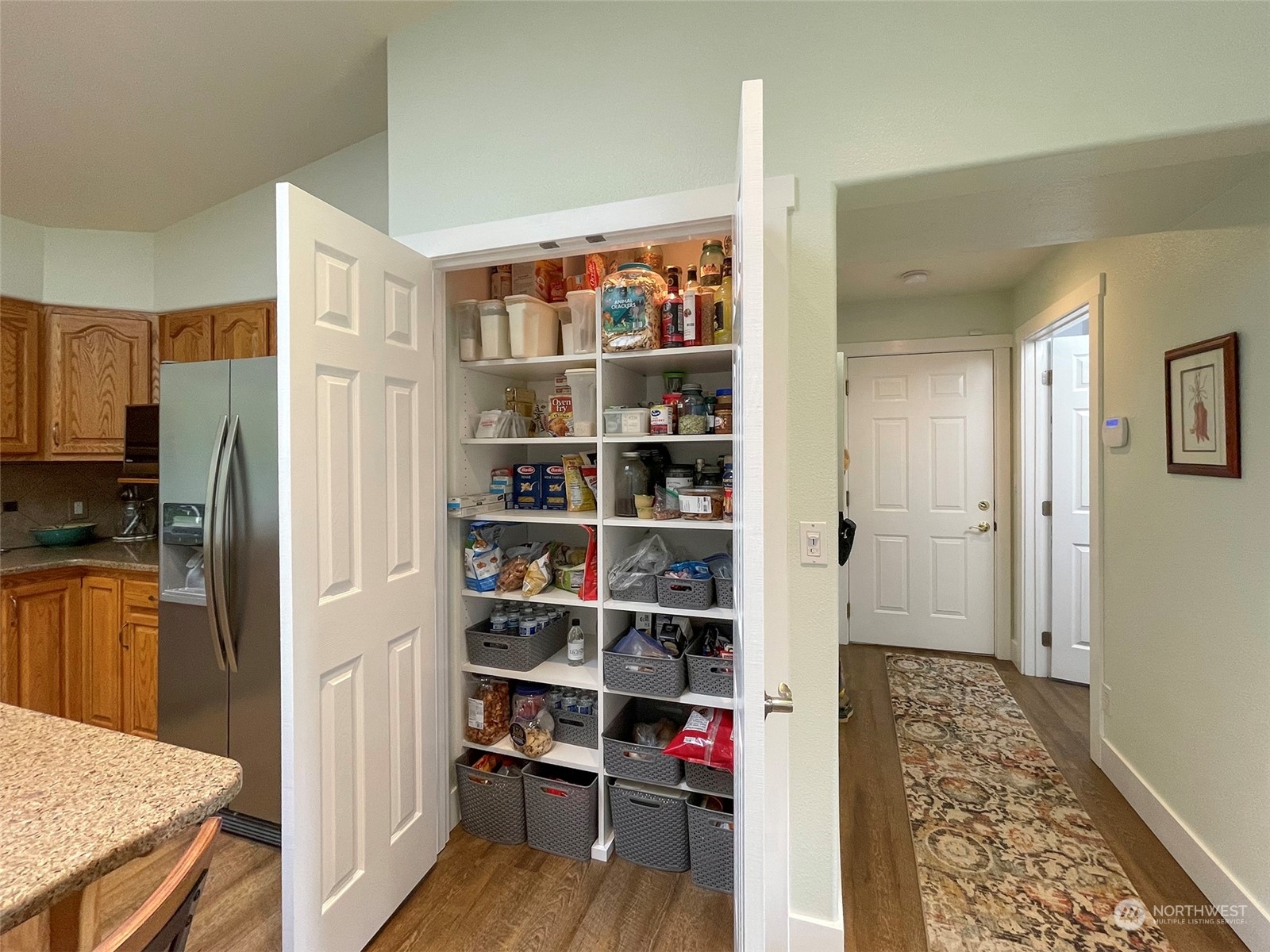 61 Sunny Dell Lane Sequim, WA 98382 - Photo 13 of 40 a view of walk in closet with wooden floor and a cabinet