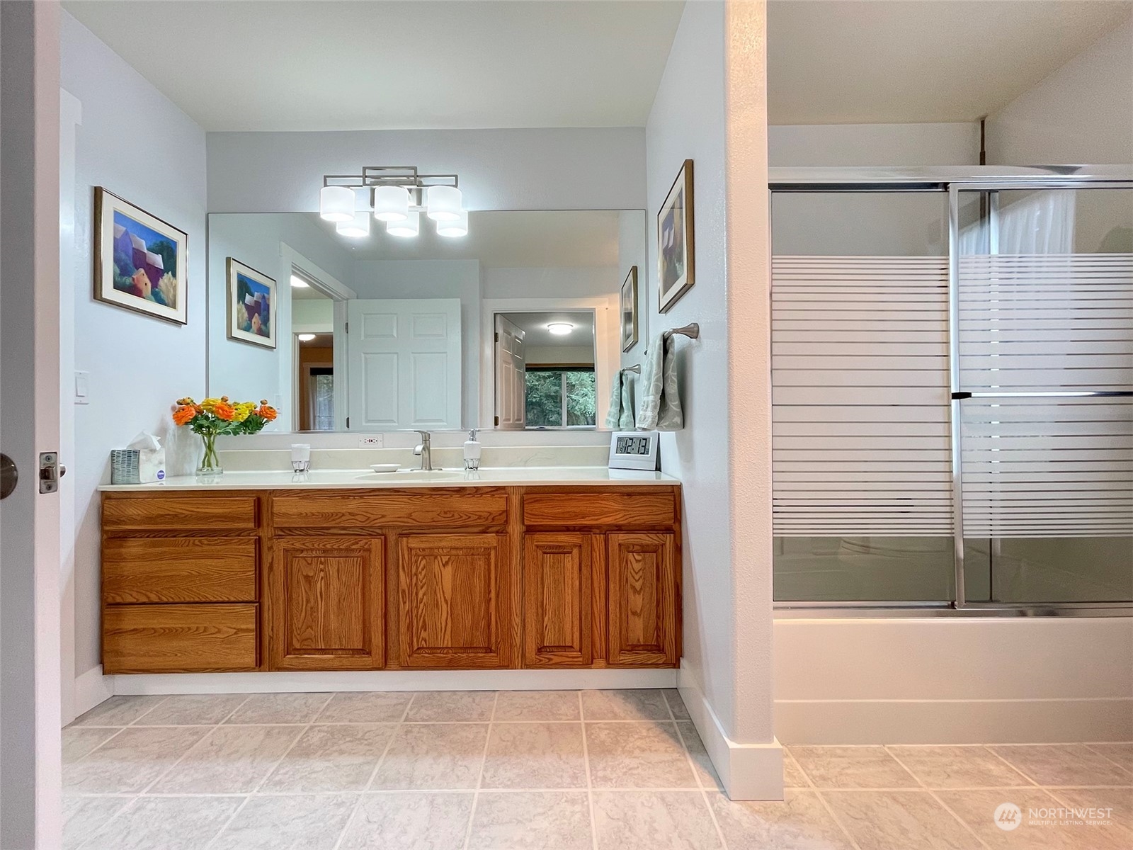 61 Sunny Dell Lane Sequim, WA 98382 - Photo 15 of 40 a bathroom with a tub sink and mirror