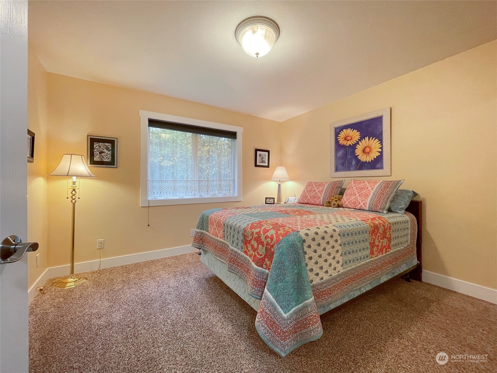 61 Sunny Dell Lane Sequim, WA 98382 - Photo 18 of 40 a bedroom with a bed and a window