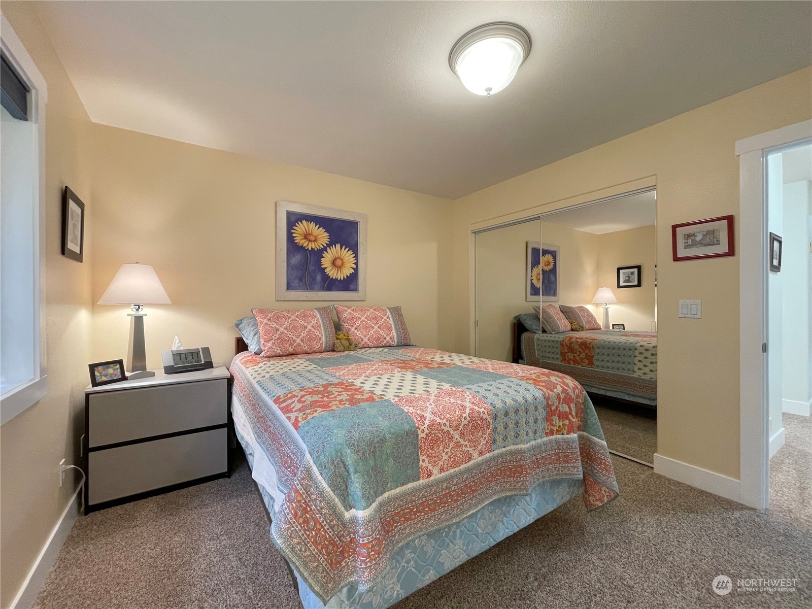 61 Sunny Dell Lane Sequim, WA 98382 - Photo 19 of 40 a bedroom with a bed and a lamp
