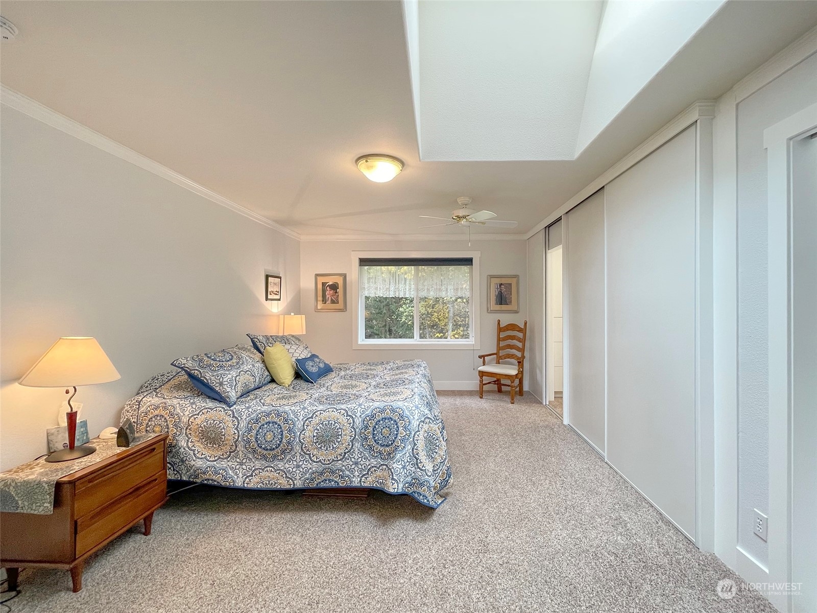 61 Sunny Dell Lane Sequim, WA 98382 - Photo 20 of 40 a spacious bedroom with a bed and window