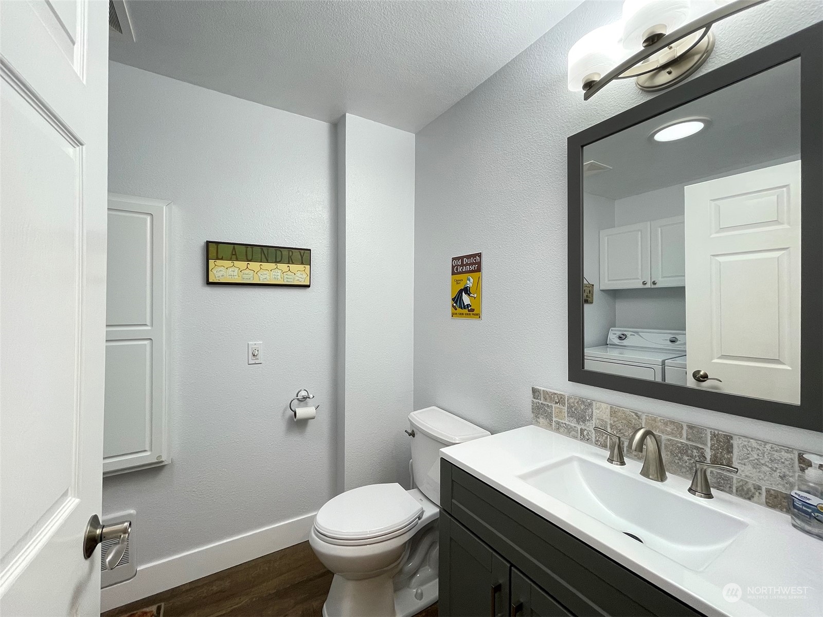 61 Sunny Dell Lane Sequim, WA 98382 - Photo 28 of 40 a bathroom with a sink a toilet and mirror
