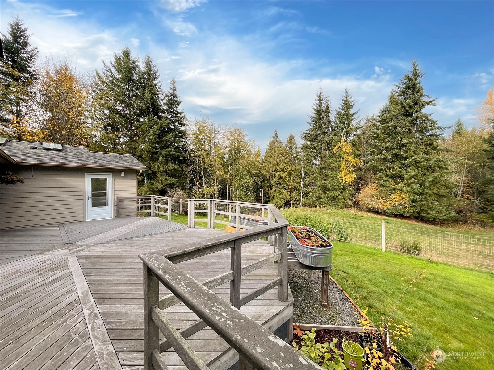 61 Sunny Dell Lane Sequim, WA 98382 - Photo 33 of 40 a view of a balcony with mountain view and wooden floor