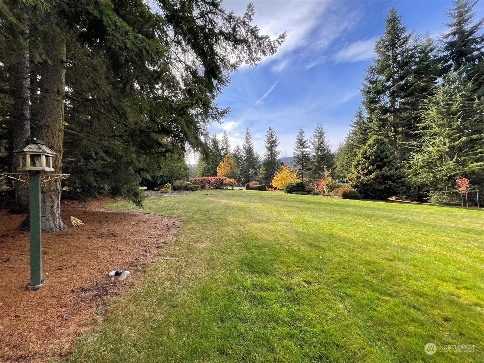 61 Sunny Dell Lane Sequim, WA 98382 - Photo 38 of 40 a backyard of a house with lots of green space