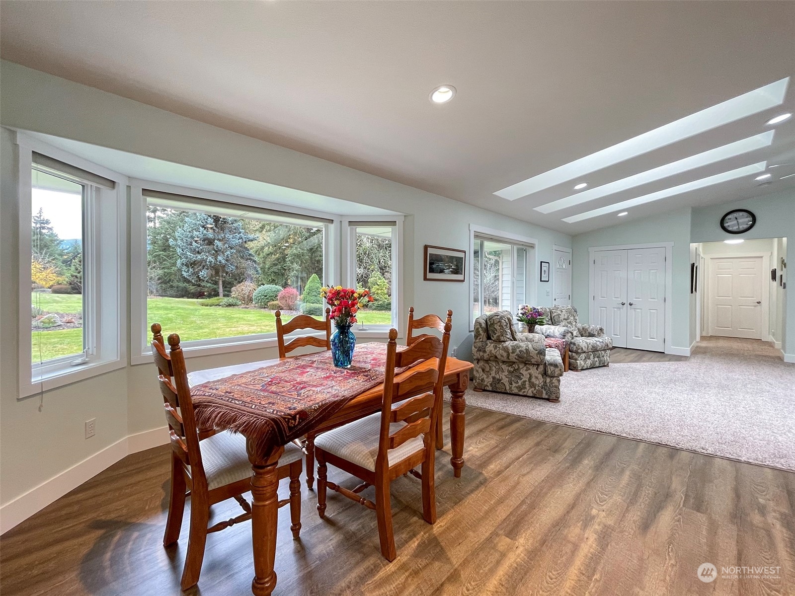61 Sunny Dell Lane Sequim, WA 98382 - Photo 8 of 40 a view of a dining room with furniture window and wooden floor