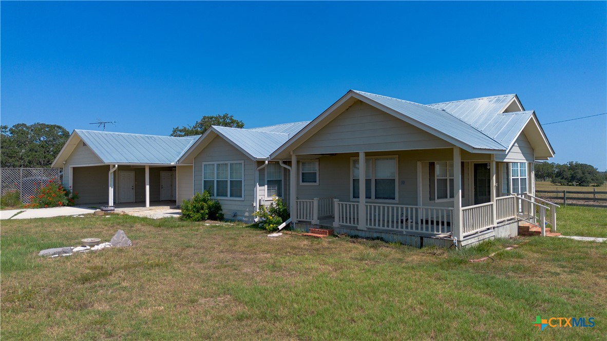 3752 Farm To Market 77 Nixon, TX 78140 - Photo 20 of 48 a front view of a house with a yard
