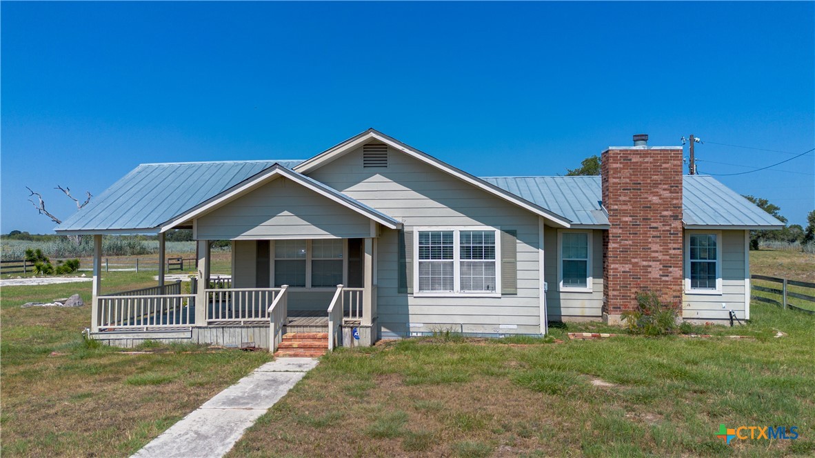 3752 Farm To Market 77 Nixon, TX 78140 - Photo 22 of 48 a view of a house with a yard and fence