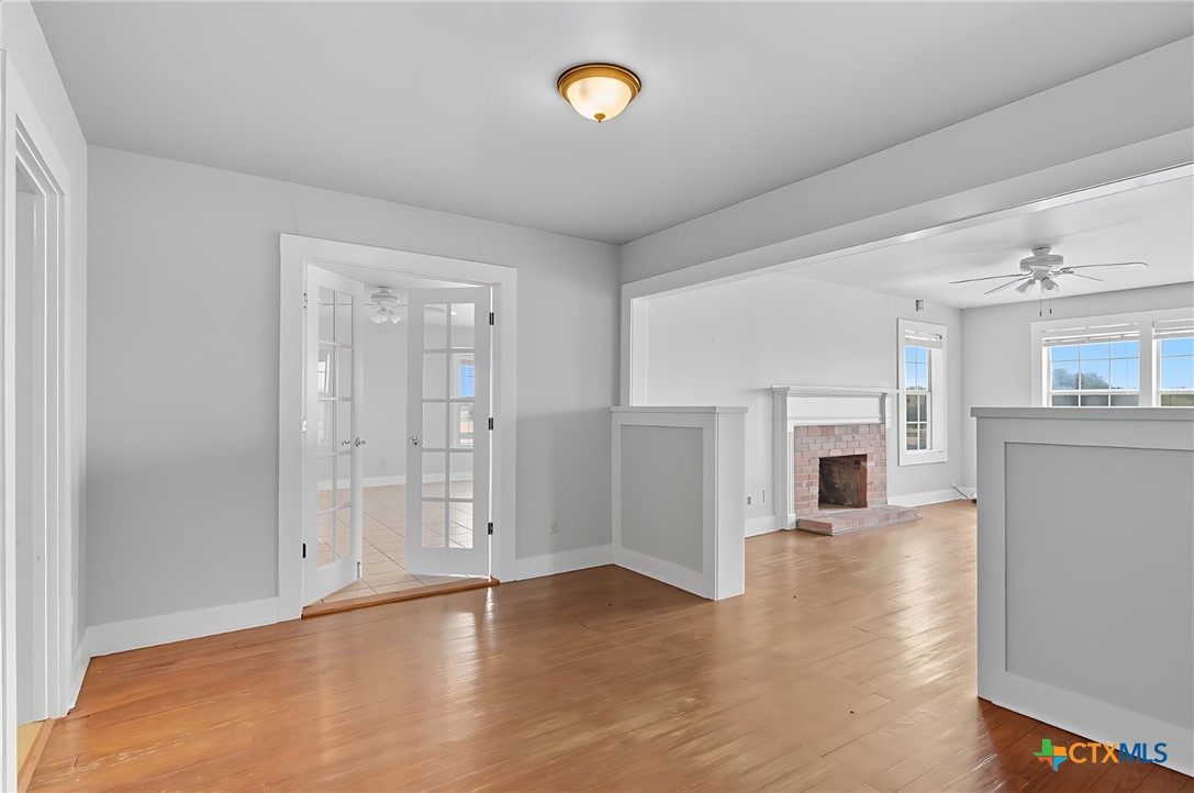 3752 Farm To Market 77 Nixon, TX 78140 - Photo 30 of 48 a view of an empty room with a fireplace and a window