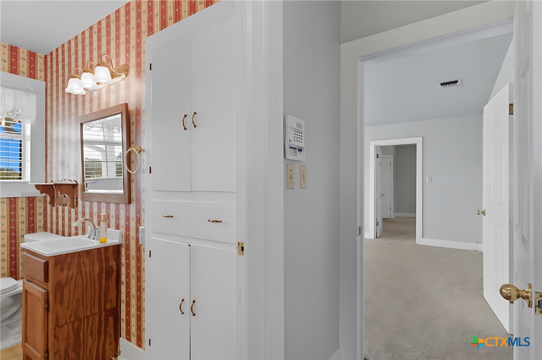 3752 Farm To Market 77 Nixon, TX 78140 - Photo 36 of 48 a view of a bedroom with a door and wooden door