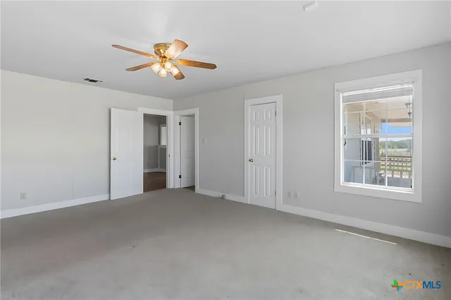 a spacious bathroom with a granite countertop sink a mirror and a
