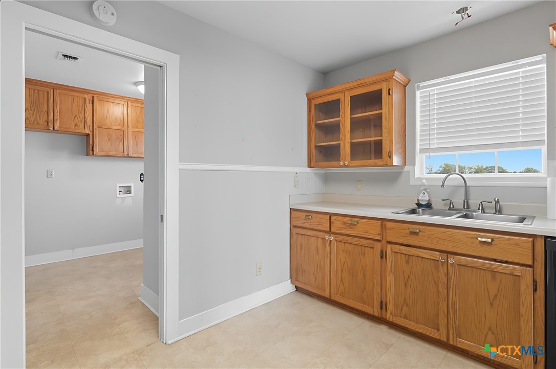 3752 Farm To Market 77 Nixon, TX 78140 - Photo 48 of 48 a bathroom with a sink and a window