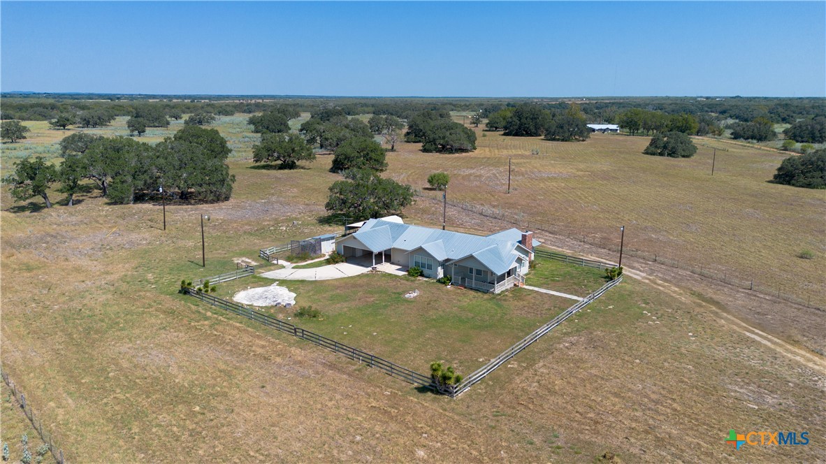 3752 Farm To Market 77 Nixon, TX 78140 - Photo 6 of 48 a view of a backyard with table and chairs