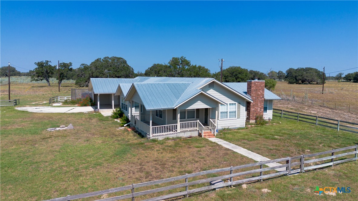 3752 Farm To Market 77 Nixon, TX 78140 - Photo 8 of 48 a view of a house with a yard