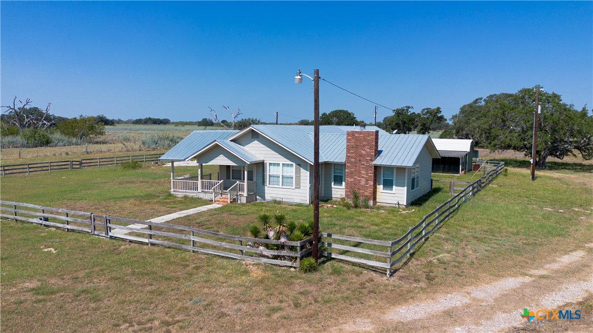 3752 Farm To Market 77 Nixon, TX 78140 - Photo 9 of 48 a view of a house with a yard