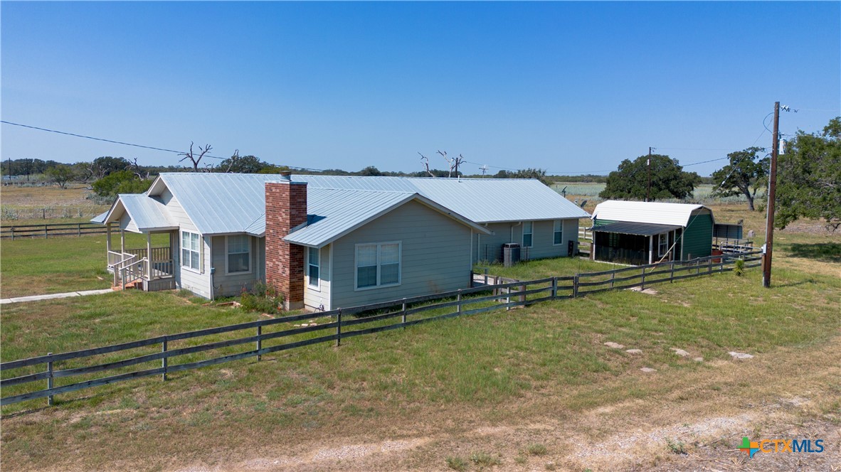 3752 Farm To Market 77 Nixon, TX 78140 - Photo 10 of 48 a house view with a garden space