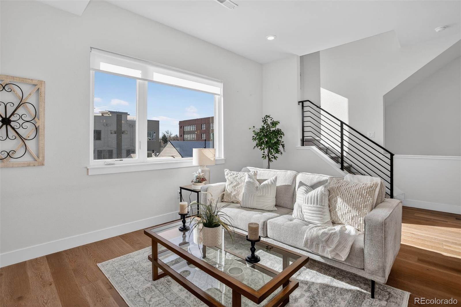 1234 Perry Street Denver, CO 80204 - Photo 11 of 29 a living room with furniture and a window
