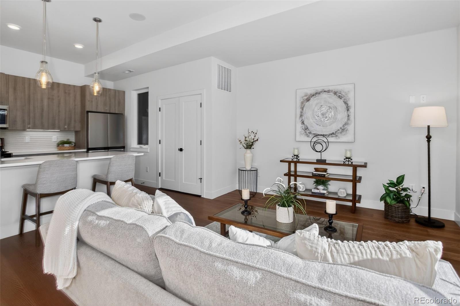 1234 Perry Street Denver, CO 80204 - Photo 12 of 29 a living room with furniture kitchen view and a window