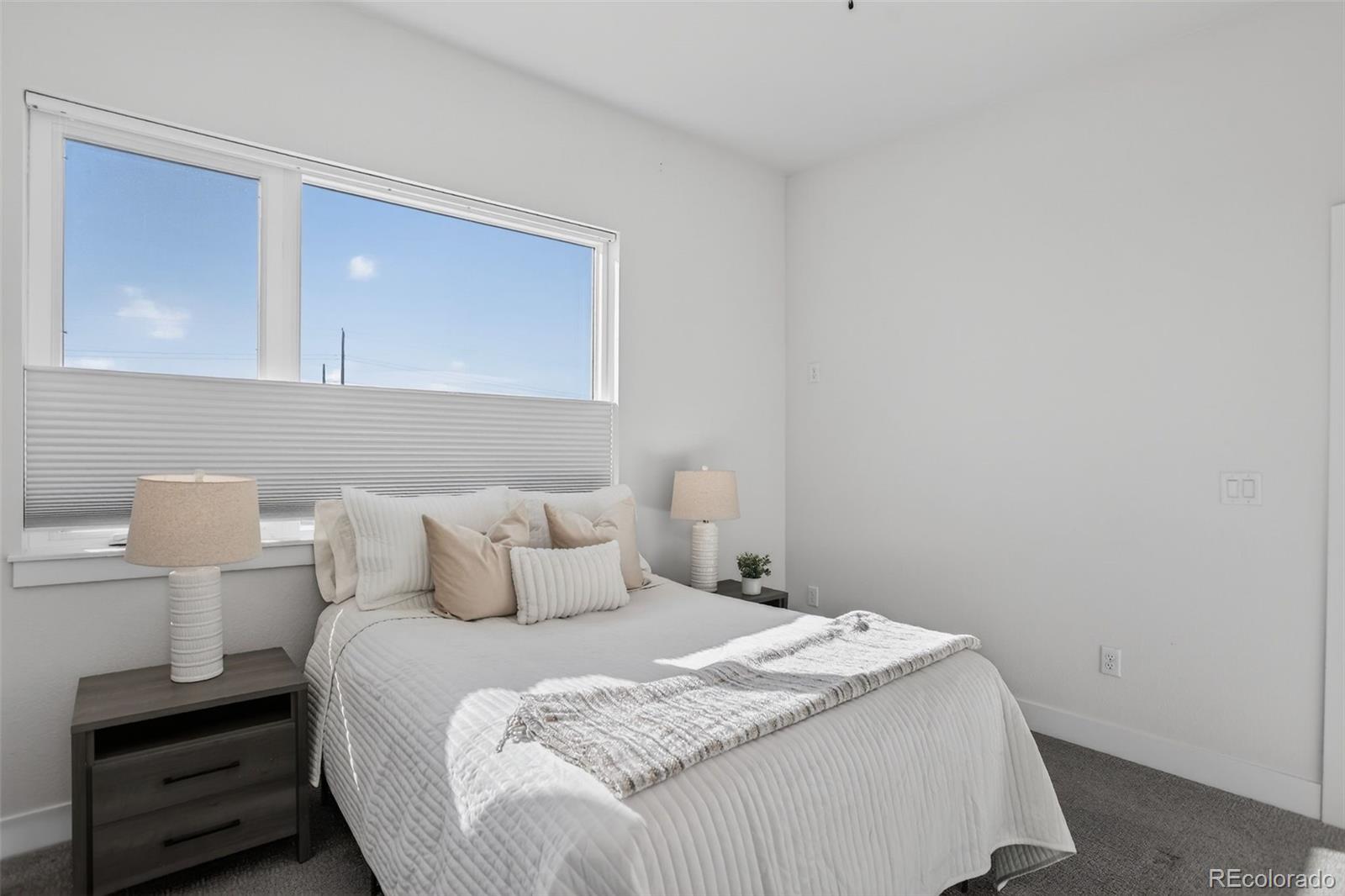 1234 Perry Street Denver, CO 80204 - Photo 15 of 29 a bedroom with a bed and a night stand