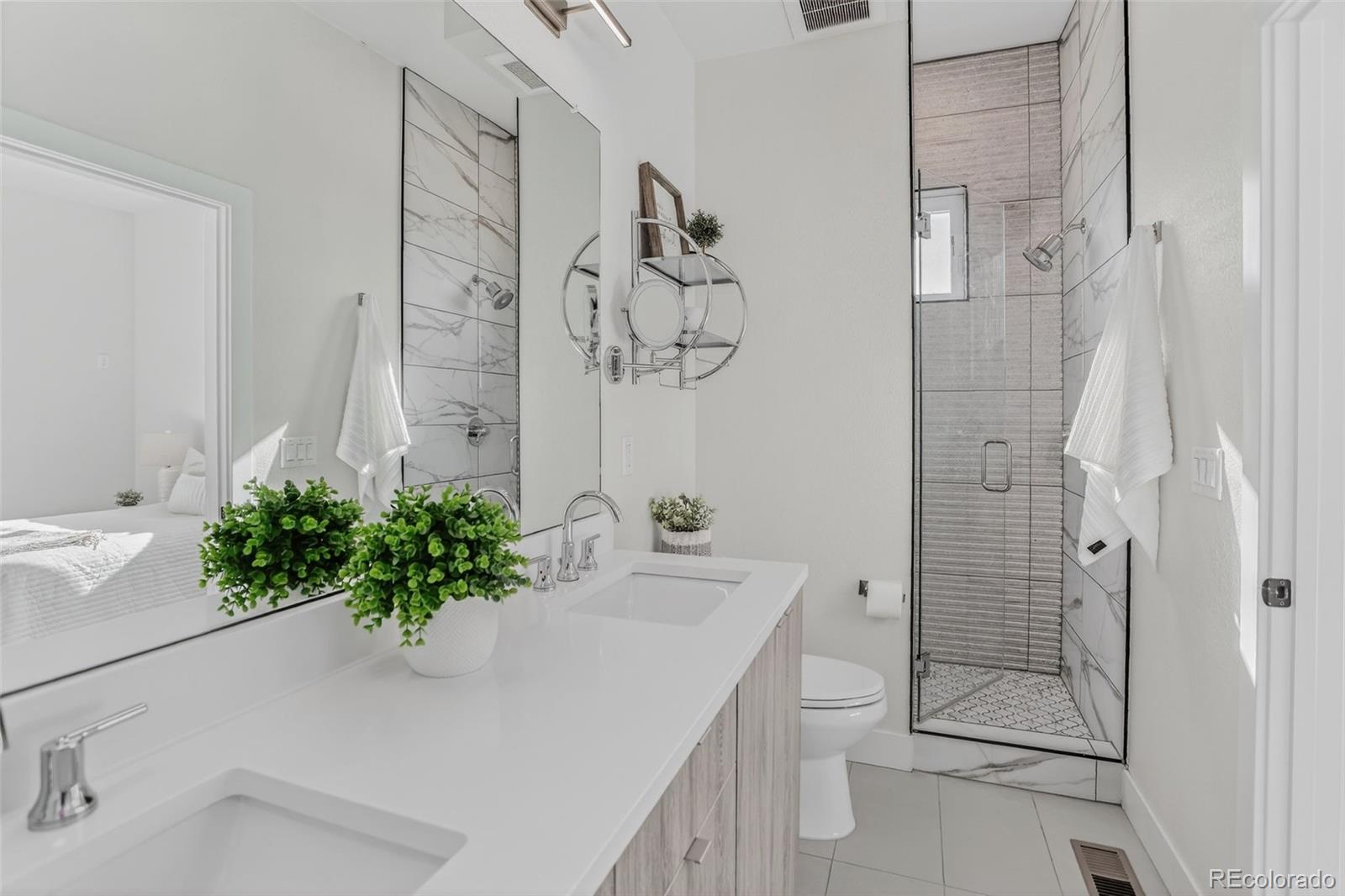 1234 Perry Street Denver, CO 80204 - Photo 16 of 29 a bathroom with a sink a toilet and shower
