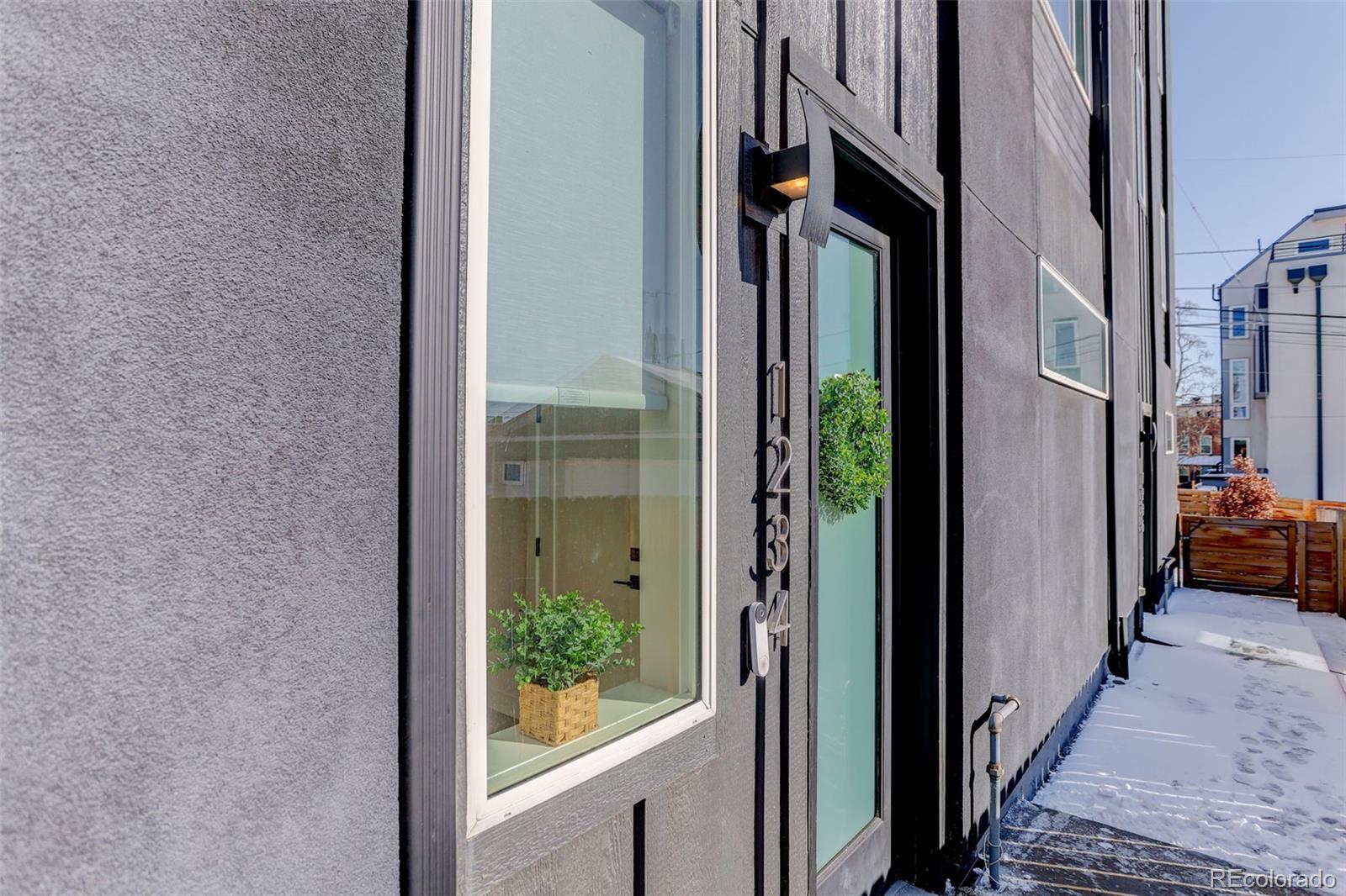 1234 Perry Street Denver, CO 80204 - Photo 3 of 29 a view of walk in closet with clothes and shoes